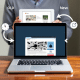 A person holds a tablet displaying an old webpage, while a laptop below shows a redesigned version of the same site.
